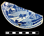 Pearlware printed underglaze saucer in pastoral motif. Rim diameter: 6.00”. Lot:  9, Provenience: 1G3.885.8, Privy Stratum 2.-18BC38